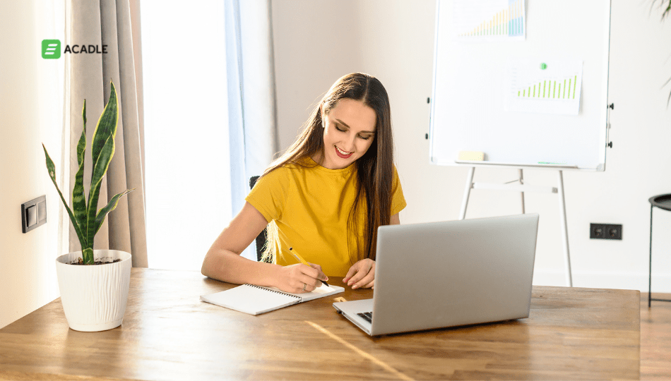 Image with a lady in a yellow dress and laptop